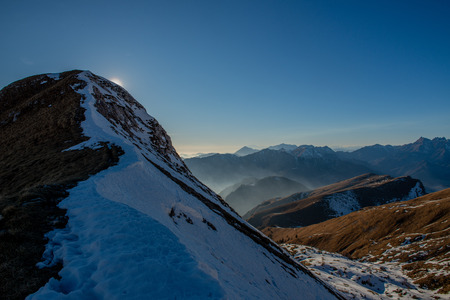 mountains with valley floor shrouded in mistの写真素材