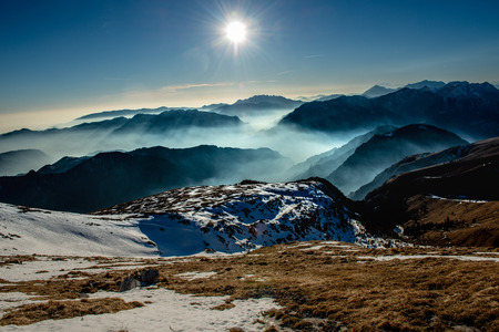 mountains with valley floor shrouded in mistの写真素材