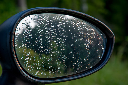 rearview mirror with rain drops after the stormの写真素材