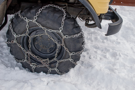 tire with snow chainsの写真素材