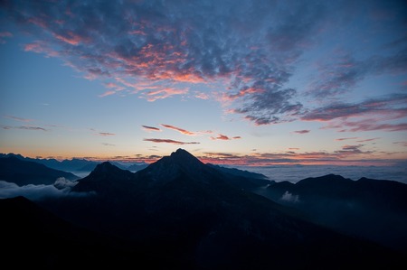 Dawn in the mountains with fogの写真素材