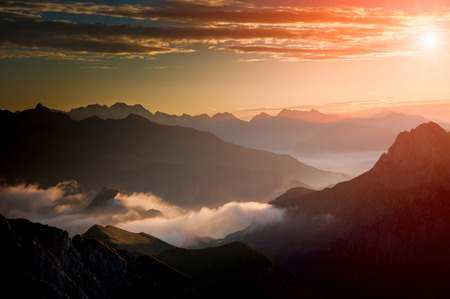 Dawn in the mountains with fogの写真素材