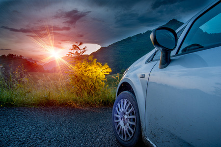 car on the road at sunsetのeditorial素材