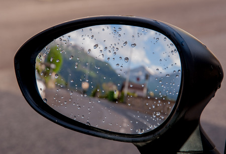 rear-view mirror of cars with water dropsの写真素材