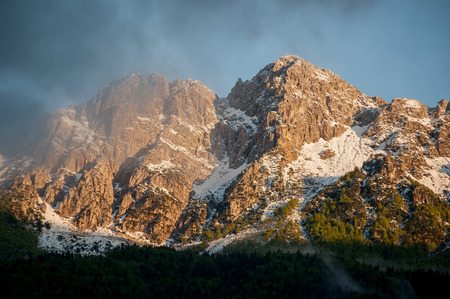 mountain in the clouds after the storm with rainbowの写真素材