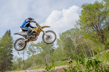 Jumping with the bike in dirt trackのeditorial素材
