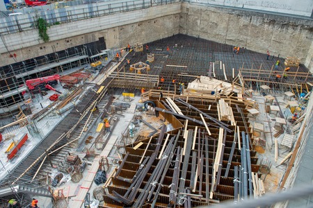 MILAN, ITALY 10 APRIL, 2019: workers at work for the construction of the reinforced concrete base in the new business district in the island districtのeditorial素材