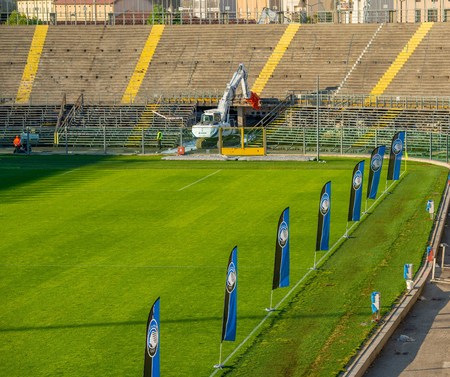 Bergamo Italy 6 May 2019: Excavator for demolition of large demolitions in action to demolish the northern curve of the Bergamo stadiumの写真素材