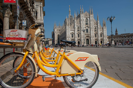 Milan Italy June 29, 2019: public bicycles parked ready to be used for non-polluting transportのeditorial素材