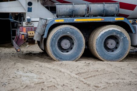 truck with concrete mixer on construction siteの写真素材