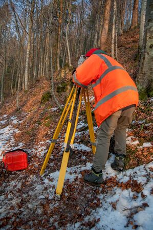 surveyor while he is doing typographic surveysの写真素材