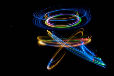 colored streaks of light in the darkの写真素材