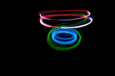 colored streaks of light in the darkの写真素材