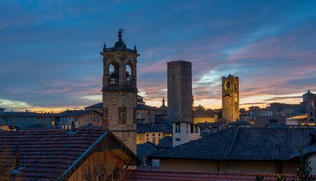 Sunset with towers in the old town of Bergamoの写真素材