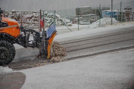 Snowplow as it clears the road of snowの写真素材