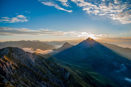 Dawn in the mountains with fogの写真素材