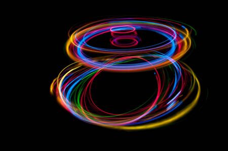 colored streaks of light in the darkの写真素材