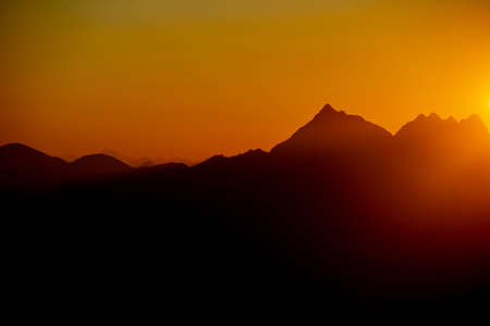 sunset over the mountains of lombardyの写真素材