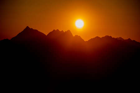sunset over the mountains of lombardyの写真素材