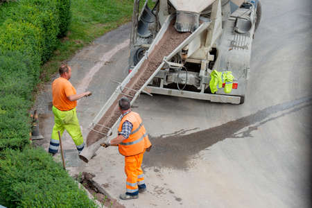 Zorzone Bergamo Italy 23 September 2020: Workers at work to bury the cables of the ultra-fast networkのeditorial素材