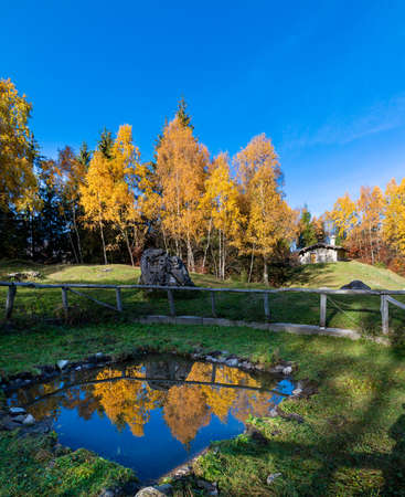 cottage with a pond where nature is reflectedの写真素材