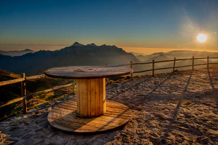 safety fence of mountain hut at sunsetの写真素材