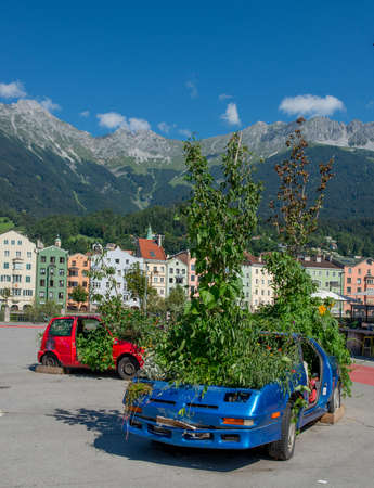 Innsbruck austria 27 July 2020: End of life car with tree sticking out of the roofのeditorial素材