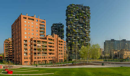 milan italy march 29 2021: Bosco Verticale "new and modern skyscraper with trees growing on the balconies, in the Isola district of Milan which is reflected in the water of the fountainのeditorial素材