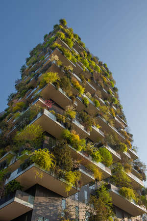 milan italy march 29 2021: Bosco Verticale "new and modern skyscraper with trees growing on the balconies, in the Isola district of Milan which is reflected in the water of the fountainのeditorial素材