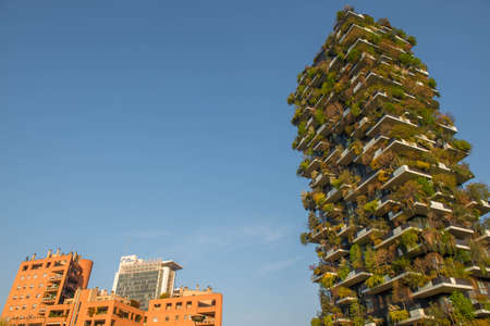 milan italy march 29 2021: Bosco Verticale "new and modern skyscraper with trees growing on the balconies, in the Isola district of Milan which is reflected in the water of the fountainのeditorial素材