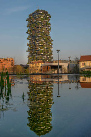 milan italy march 29 2021: Bosco Verticale "new and modern skyscraper with trees growing on the balconies, in the Isola district of Milan which is reflected in the water of the fountainのeditorial素材