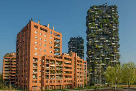 milan italy march 29 2021: Bosco Verticale "new and modern skyscraper with trees growing on the balconies, in the Isola district of Milan which is reflected in the water of the fountainのeditorial素材