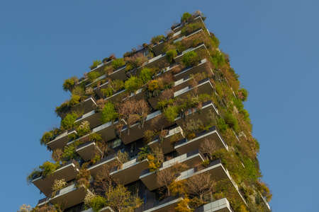 milan italy march 29 2021: Bosco Verticale "new and modern skyscraper with trees growing on the balconies, in the Isola district of Milan which is reflected in the water of the fountainのeditorial素材