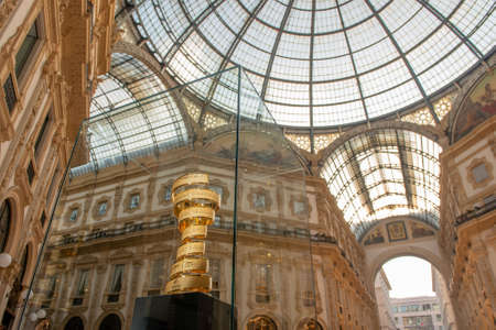 milan italy 3 may 2021: cup awarded to the winner of the 2021 cycling tour of italy on display in the vittorio emanuele gallery in milanのeditorial素材
