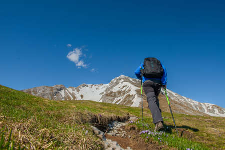 Beyond the hill Bergamo Italy 25 May 2021: Ascent of Mount Arera beyond the hill with snowshoes in springのeditorial素材