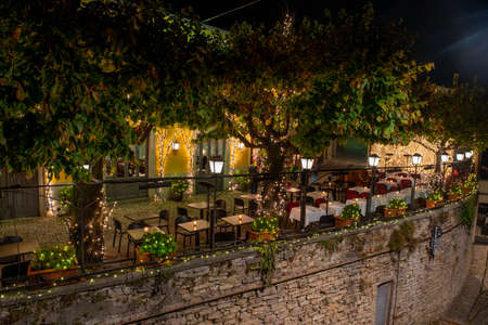 restaurant with outdoor tables in the upper town of Bergamoの写真素材