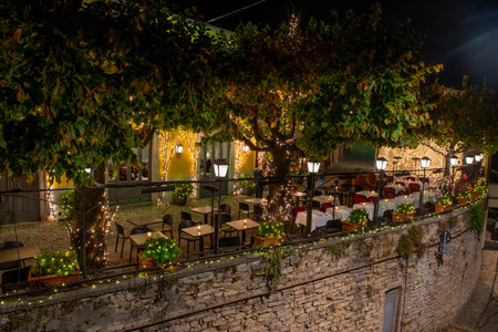 restaurant with outdoor tables in the upper town of Bergamoの写真素材