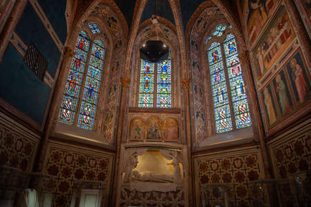Assisi Italy April 24 2022: Faithful visiting the lower basilica of San Francesco d'Assisi,...