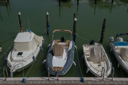 Cattolica Italy 21 June 2022: Small boats docked in the port in Roman Emiliaのeditorial素材
