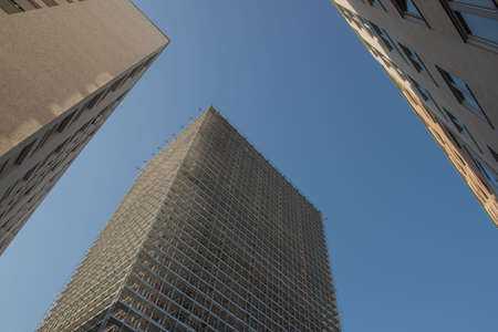 Building with scaffolding and protective