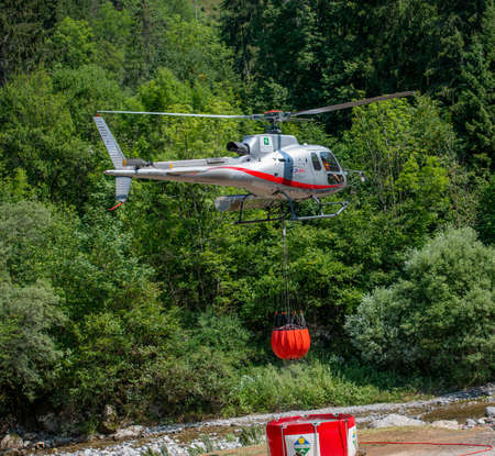 Bergamo Italy 20 July 2022: Helicopter used to transport water to put out firesの写真素材