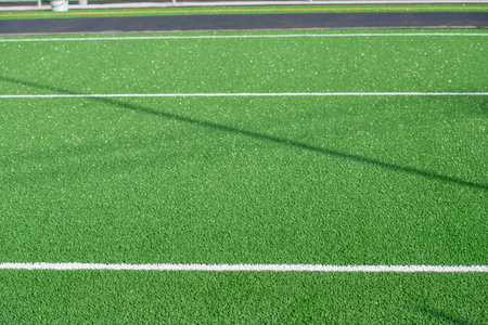 Laying of synthetic grass in a sports centerの写真素材