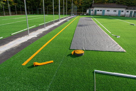 Laying of synthetic grass in a sports centerの写真素材