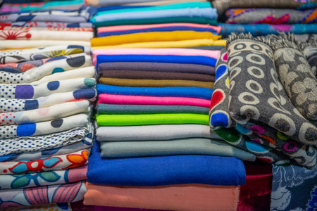 Colorful fabrics on display at the marketの写真素材