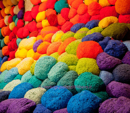 Wool cushions in the colors of the rainbowの写真素材