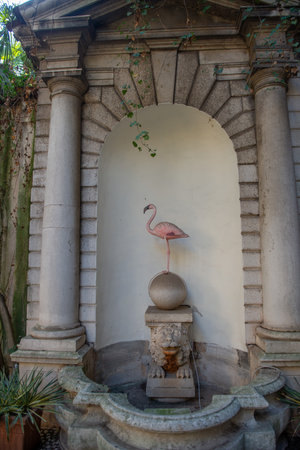 Italy, Brescia - February 12, 2023 :Pink flamingo sculpture in homage to endangered animalsの写真素材