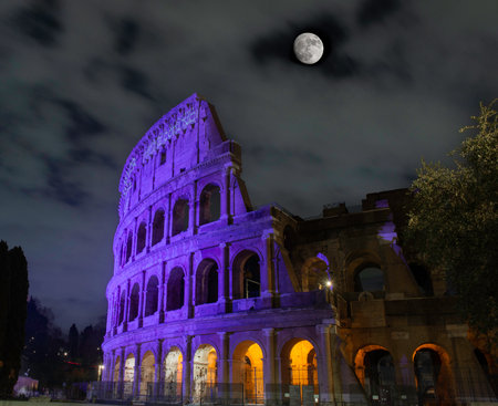 Rome Italy 14 March 2023: Colosseum illuminated in purple to raise awareness of scientific research against cancerの写真素材