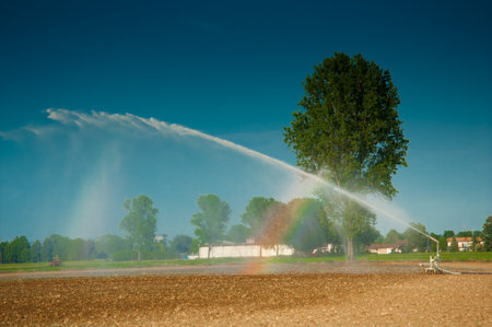 Water jet to irrigate agricultural fields in Lombardyの写真素材