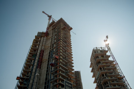 Milan Italy 6 September 2012: Cranes at work in the construction of the Isola district of Milanの写真素材