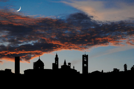 Bergamo Alta skyline at sunset with moonの写真素材
